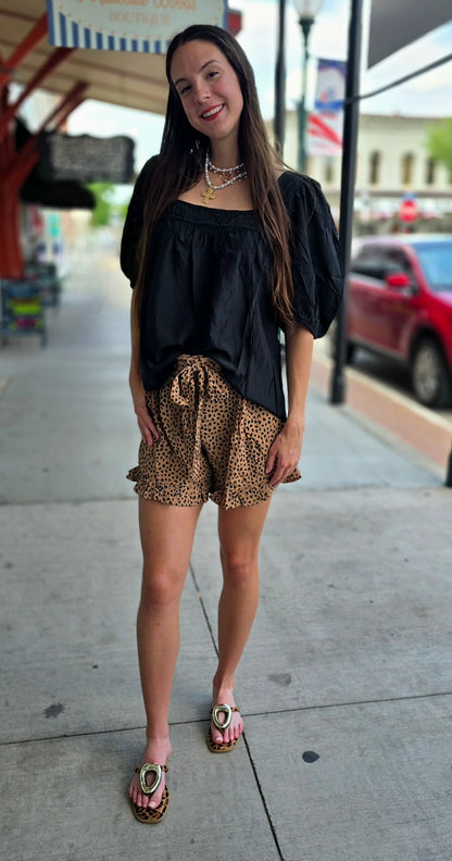Tan and black animal print shorts
