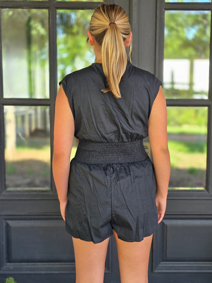 Black smocked waste romper