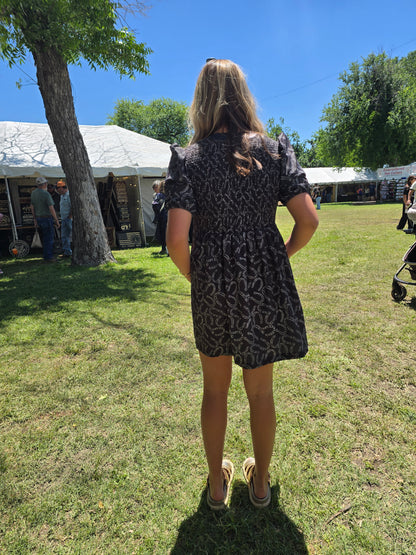 Black horseshoe dress
